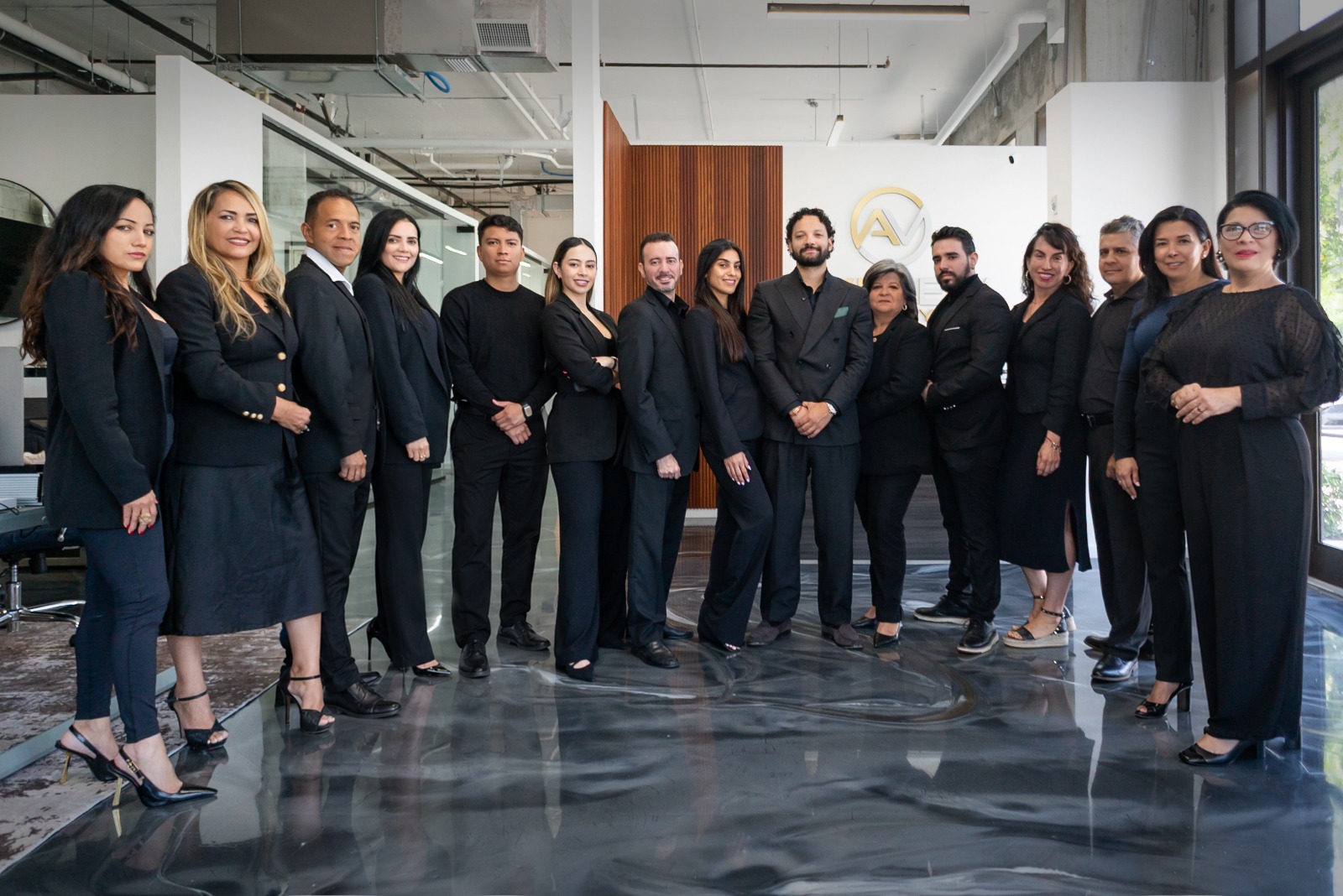The Method team, in black, at their Brickell office in Miami